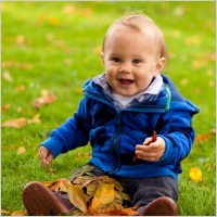 baby playing in fall