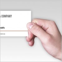 Business card in a man’s hand