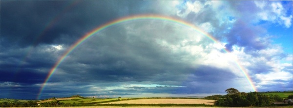 Where can you find free photographs of rainbows?