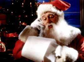 Santa Claus reading Wallpaper Christmas Holidays