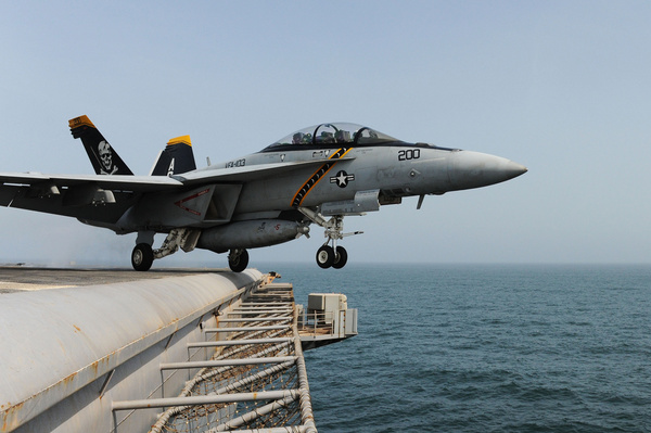 a jet launches from the flight deck 