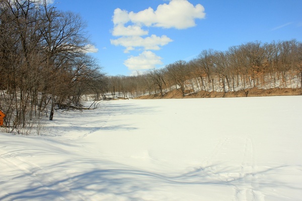 a small lake frozen at lake maria state park minnesota