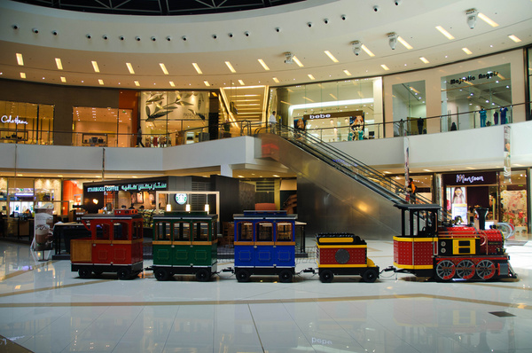 a train inside the dubai marina mall