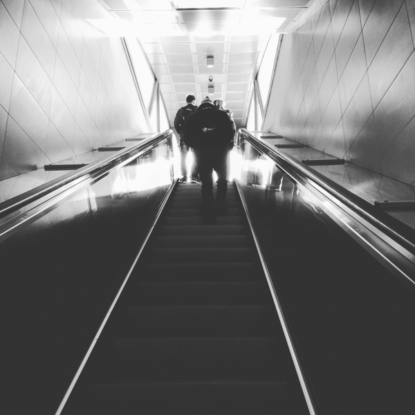 action adult airport blur climbing escalator indoors