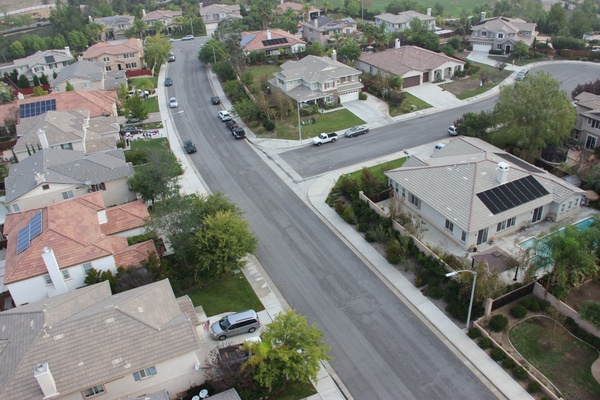 aerial view of curved street through neighborhood