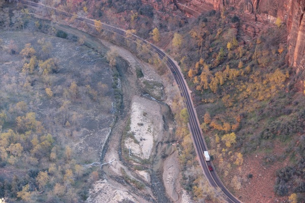 aerial view of road through canyon