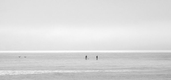 alone beach black and white boat coast fog lake 