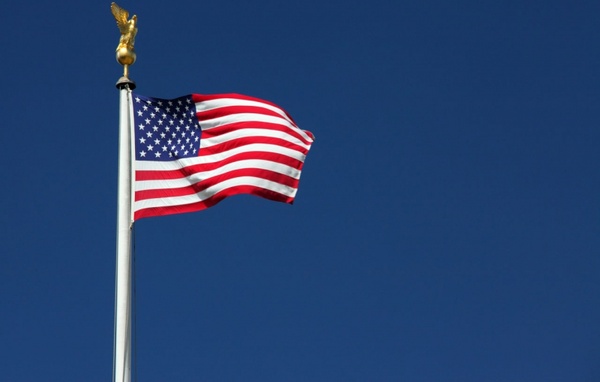 american flag with blue sky 