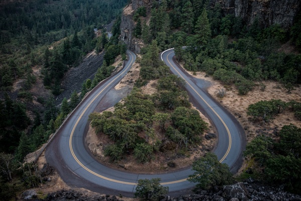 asphalt curve daytime environment forest highway