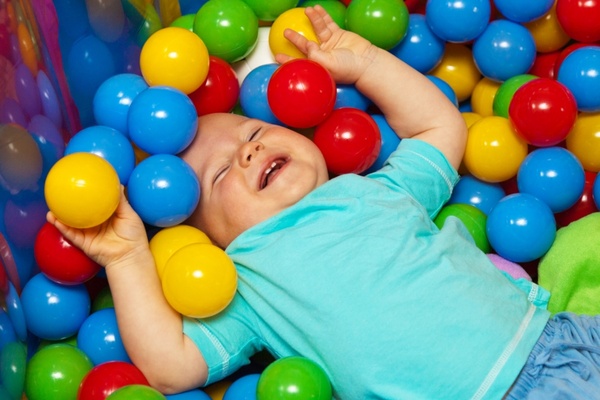 baby with play balls