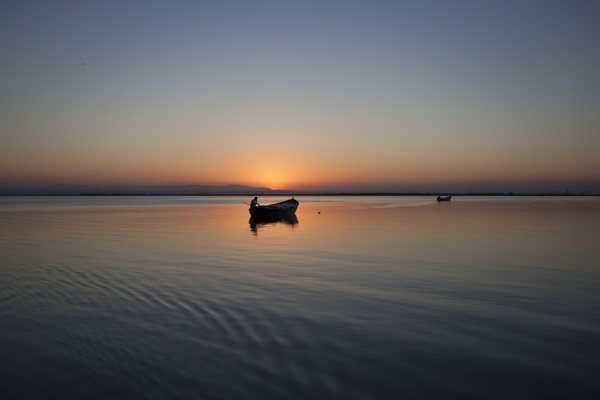 beach boat calm dawn dusk evening fisherman lake