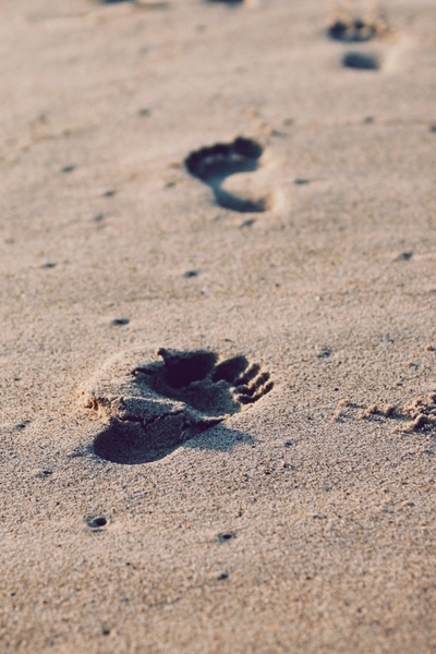 beach close up foot footprint pebble sand walking 