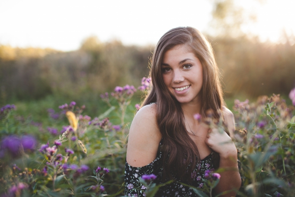 beautiful woman in flowers field