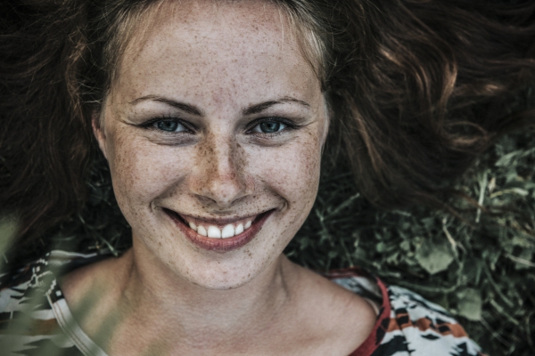 beautiful woman with lots of freckles on face