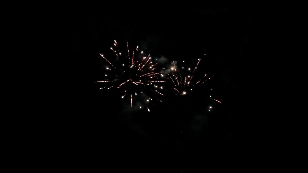 beautiful sparkling fireworks explosion on dark sky