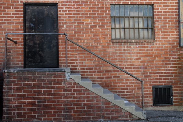 black door 038 staircase on brick building