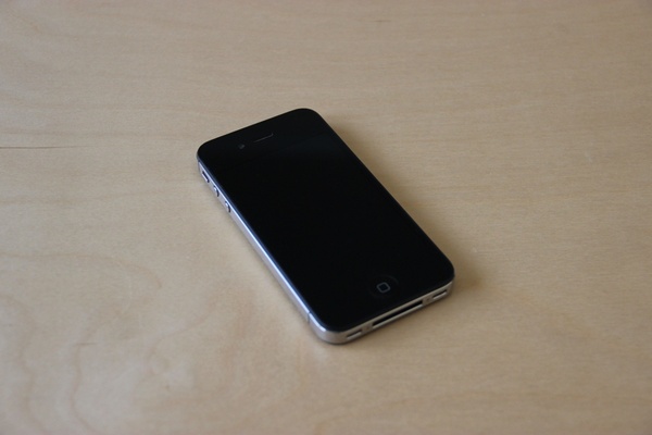 black iphone on light wood