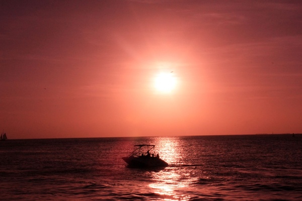boat under the red sun at key west florida 