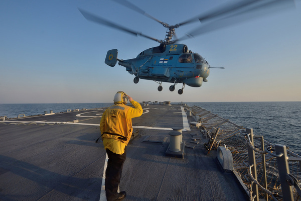 boatswains mate 3rd class jennifer sahley salutes as a ukrainian navy helicopter 