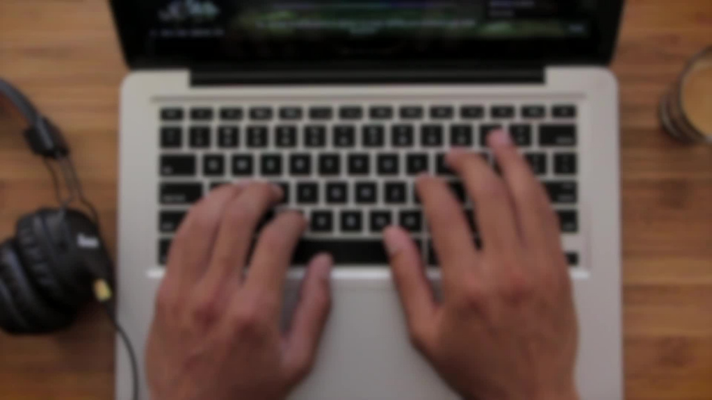 bokeh clip of skillfull hands typing laptop