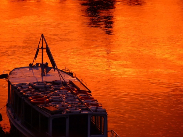boot water sunset red orange