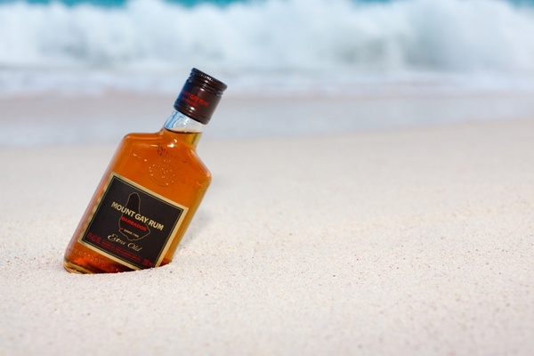 bottle of rum on the beach