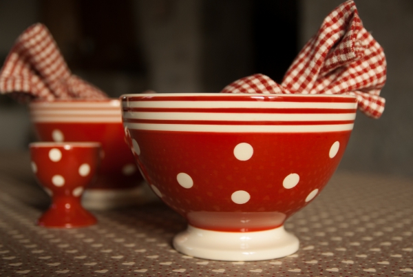 closeup of traditional red pottery bowls and cups