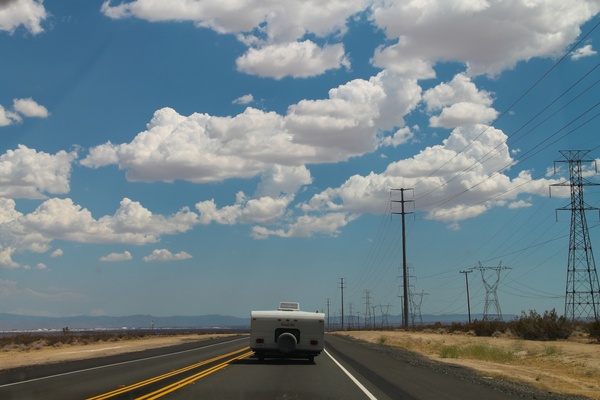 camper driving on desert road