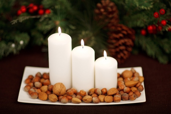 candles and nuts on plate