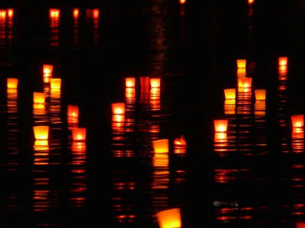 candles lights river