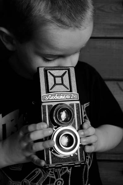 child and reflex camera