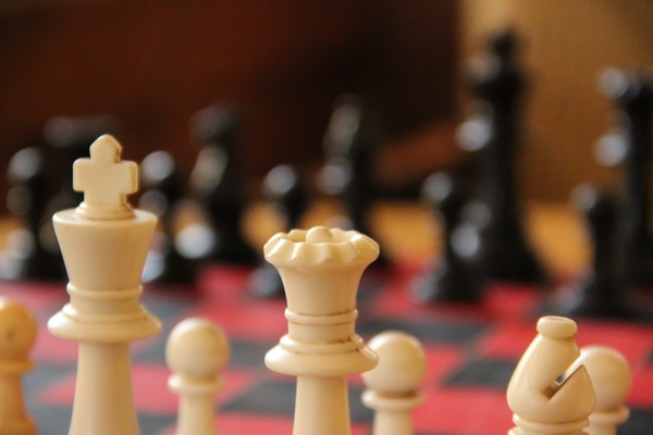 close up of chess pieces on chess board