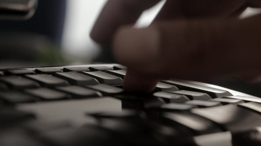 closeup of hand practicing keyboard typing