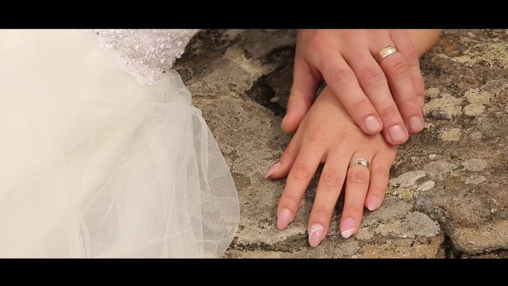 closeup of romantic groom and bride hands
