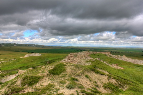 clouds and trail to the horizon at white butte north dakota 