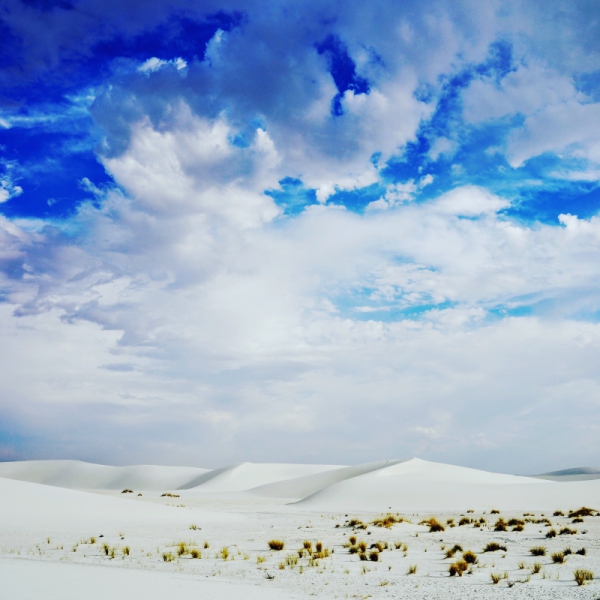 big cloudscape above white desert