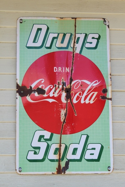 coca cola signs rusty 