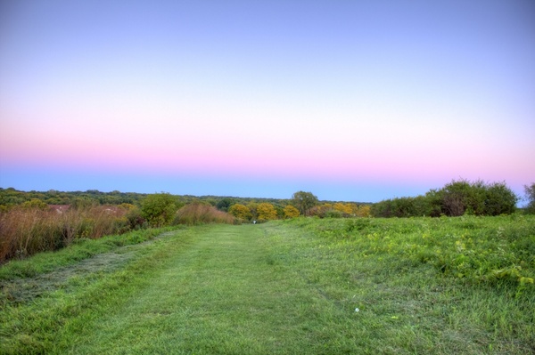 colored dusk skies above the hiking trail in madison wisconsin