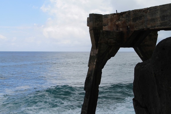 concrete structure over ocean waves