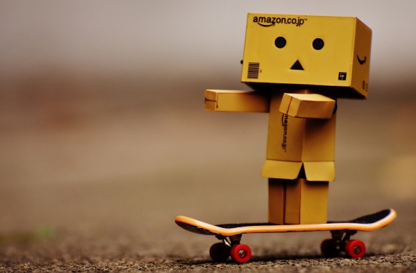 tiny wooden robotic toy model with skateboard