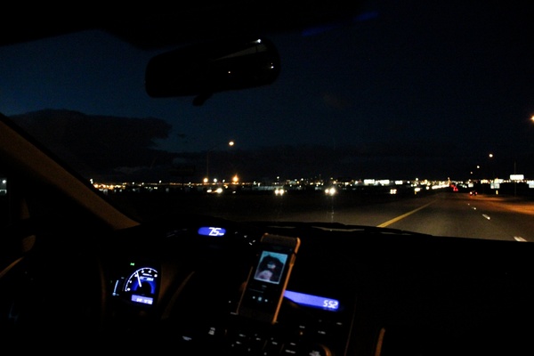 dashboard of car driving at night