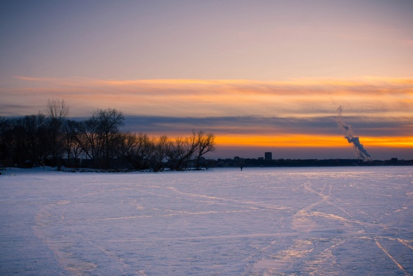 dusk over the frozen lake landscape on lake mendota madison wisconsin