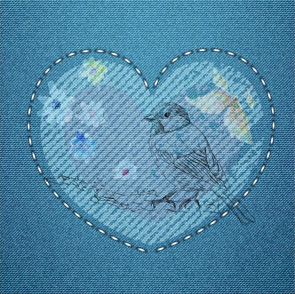 embroidery bird and heart pattern on jean background