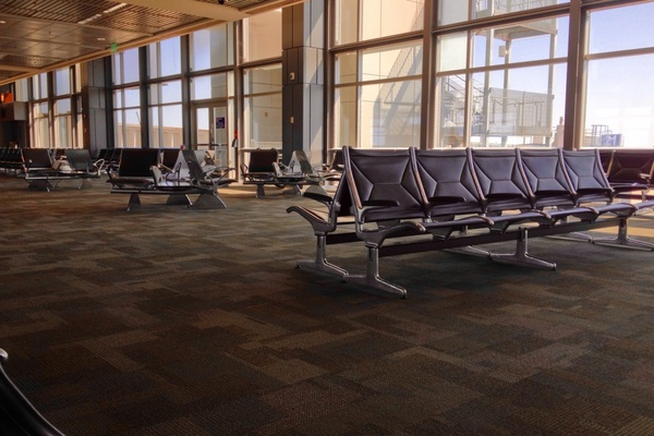 empty chairs in airport terminal