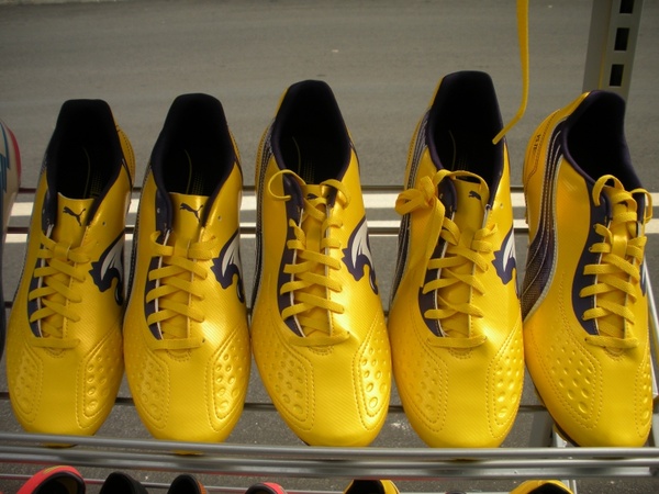 exhibition shelf running shoes yellow