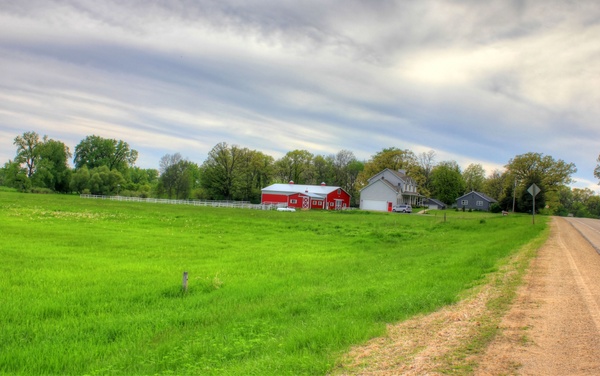 farmhouse and barn in the landscape in southern wisconsin