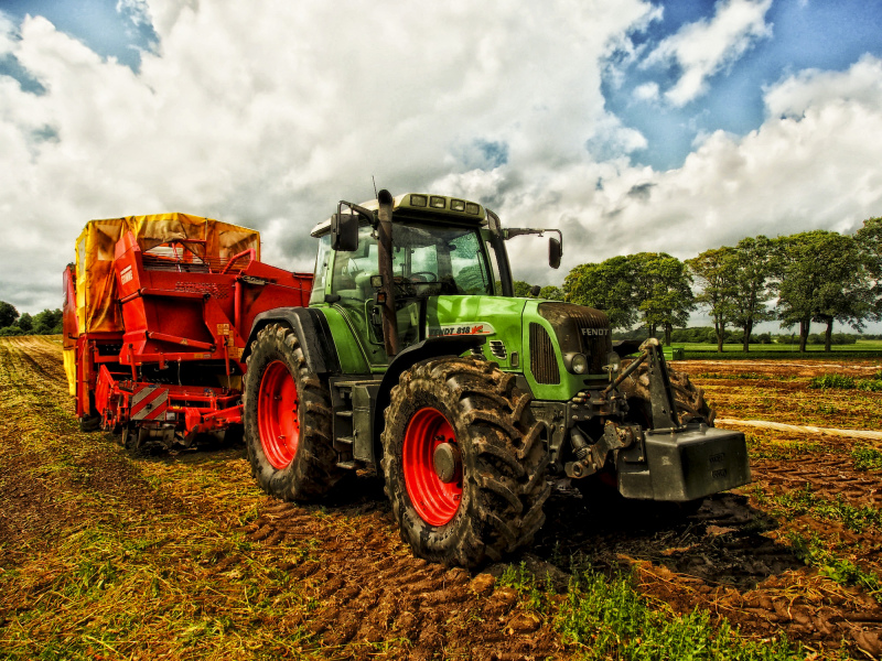 farmland scenery picture working tractor on field 