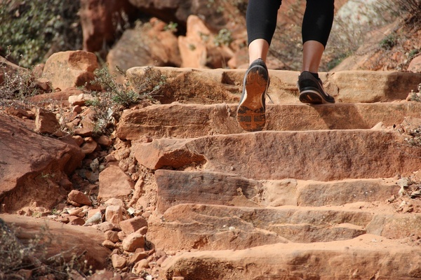 feet walking up rock steps