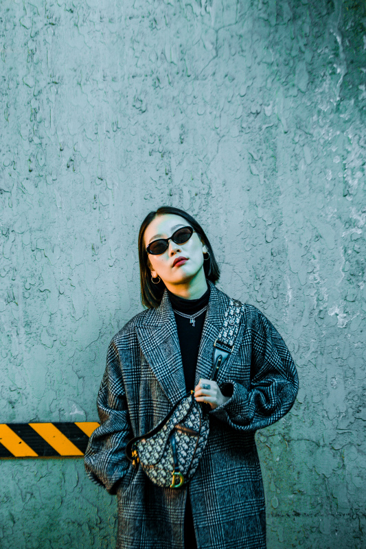 female fashion picture elegant woman posing with jacket sunglasses 