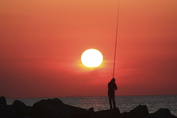 fisherman sunset greece